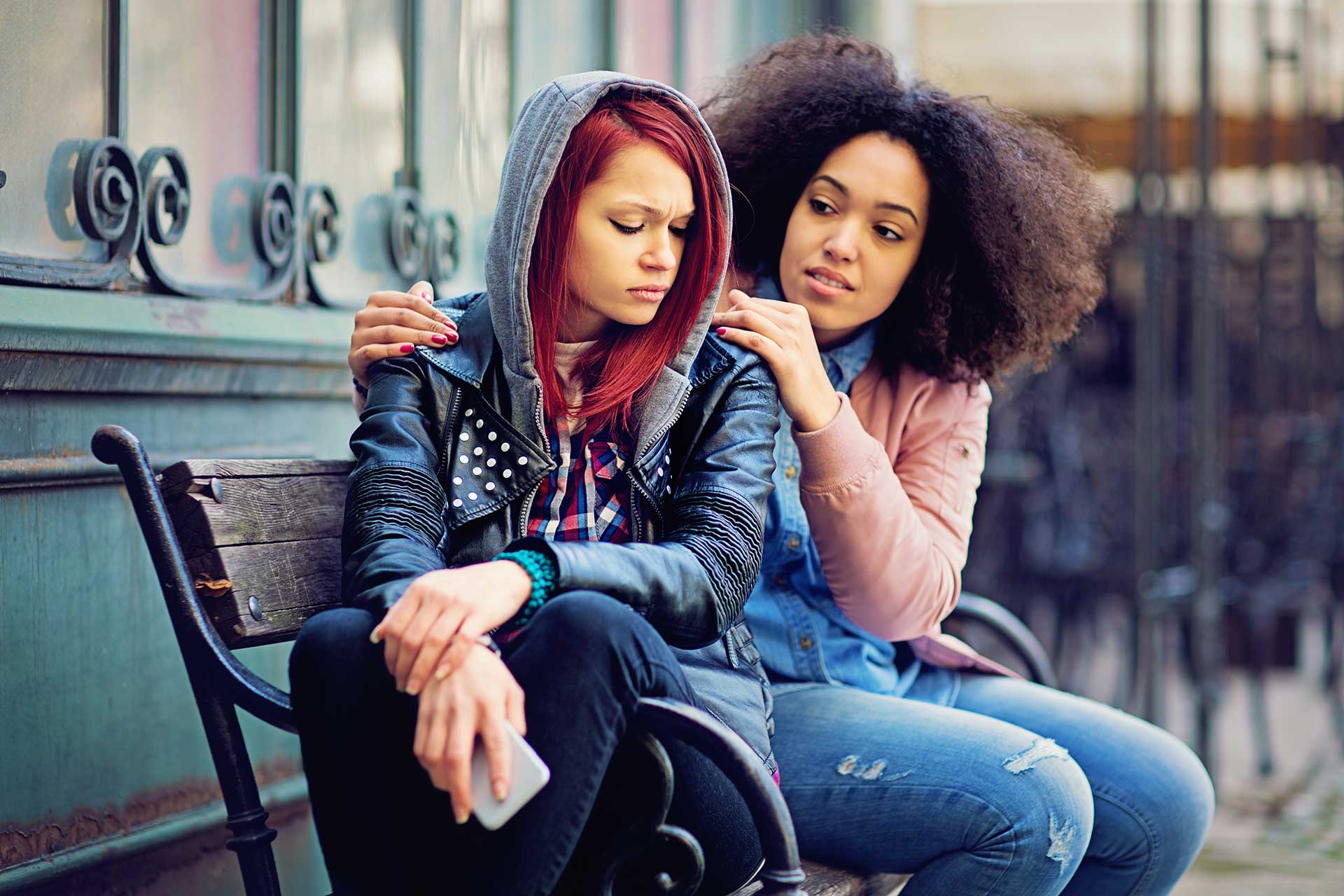 Girl consoling her friend