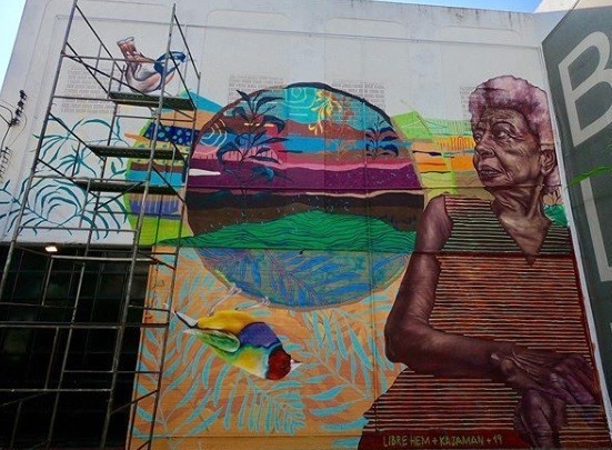 Participatory community mural in creation as part of the GlobalGRACE Partnership and Capability Event, May 2019, Rio de Janeiro, Brazil. Mural by Alfred ‘Libre’ Guitterez, commissioned by the organisers and inspired by and painted in collaboration with the women and men, children and young people in the community of Bela Marė.